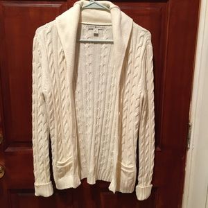 Cream-colored cable-knit cardigan